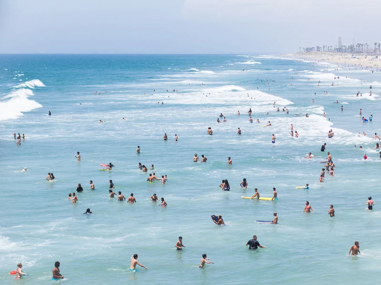 Swimmers in the surf at Huntington Beach
