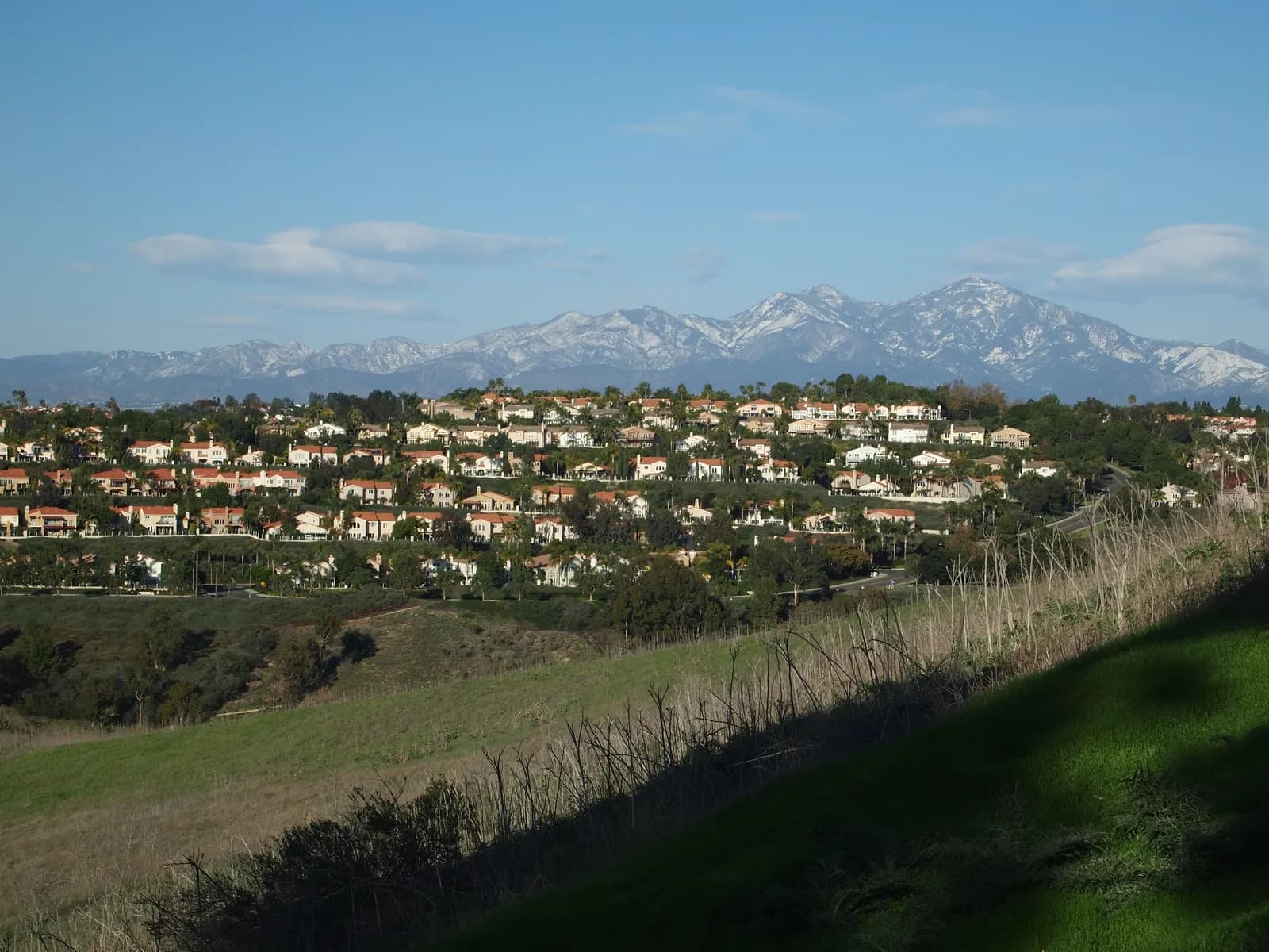 Laguna Niguel homes with the snow-capped Santa Ana Mountains behind